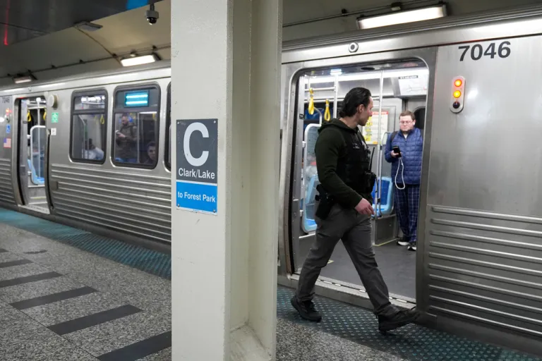 A Chicago police officer patrols the Clark Street and Lake Street Blue Line stop.