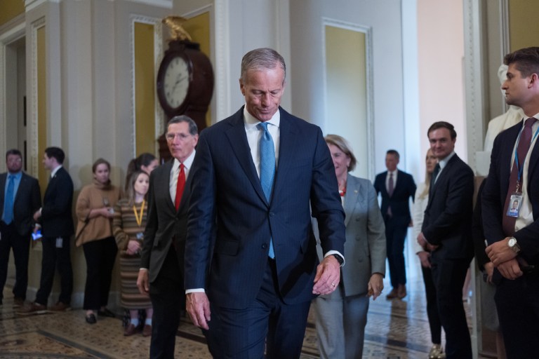 Senate Majority Leader John Thune, R-S.D., walks to speak with reporters after a closed-door GOP meeting at the Capitol in Washington, Wednesday, Nov. 19, 2025