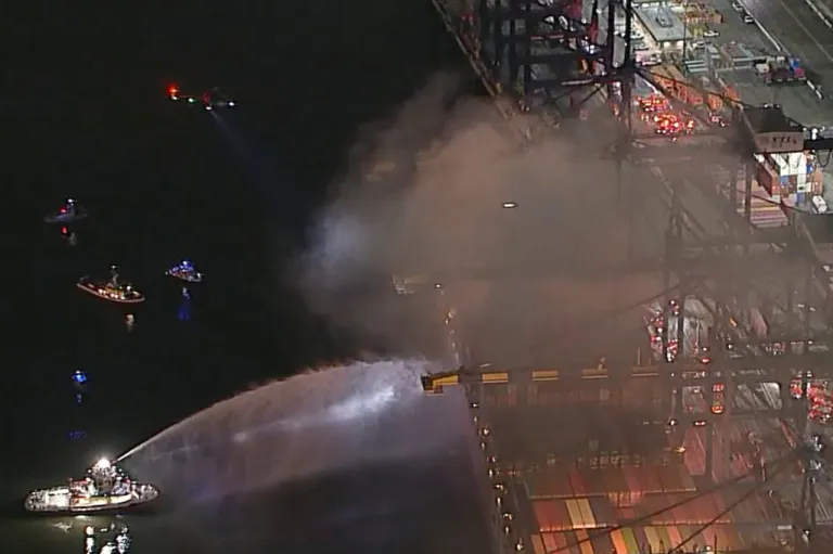 First responders fight fire on a container ship in LA