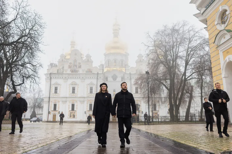 In this photo provided by the Ukrainian Presidential Press Office, Ukrainian President Volodymyr Zelenskyy and his wife Olena walk after commemorative ceremony for victims of the Holodomor, Great Famine, that killed millions in the 1930's, in Kyiv, Ukraine, Saturday, Nov. 22, 2025.