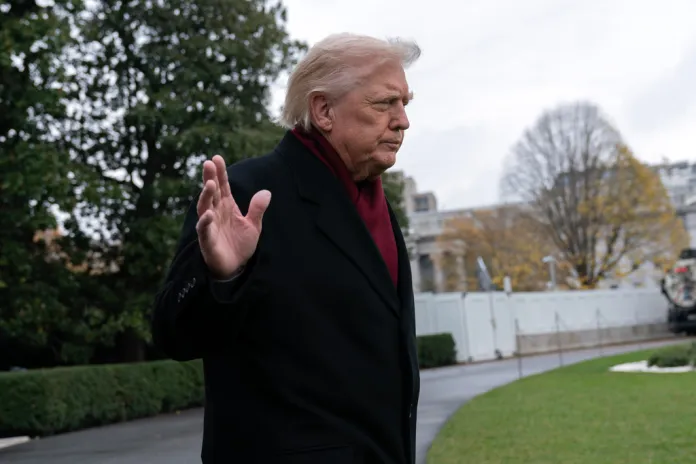 President Donald Trump waves to reporters as he departs from the South Lawn of the White House, Saturday, Nov. 22, 2025, in Washington, en route to Joint Base Andrews