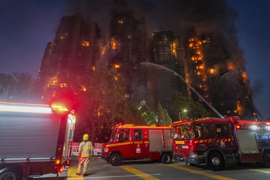 At least 36 killed and dozens injured after massive fire engulfs residential complex in Hong Kong