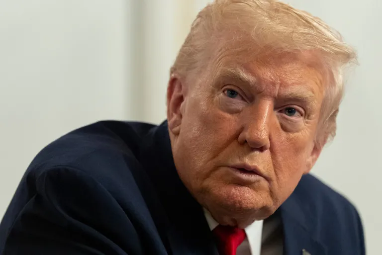 President Donald Trump speaks to reporters after speaking to troops via video from his Mar-a-Lago estate on Thanksgiving, Thursday, Nov. 27, 2025, in Palm Beach, Fla. (AP Photo/Alex Brandon)