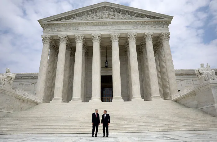 Justice Neil Gorsuch and Chief Justice John Roberts in front of the Supreme Court. (JIM WATSON/AFP via Getty Images)