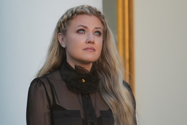 Erika Kirk listens as a military aide reads the citation before President Donald Trump posthumously awards the Presidential Medal of Freedom to Charlie Kirk.