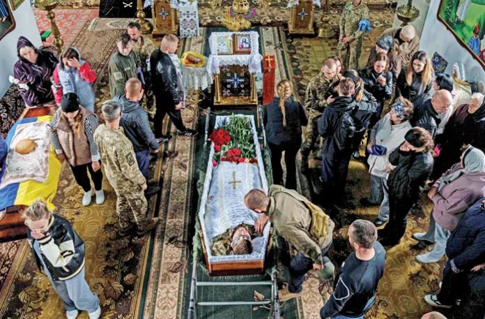 Mourners at the funeral of a Ukrainian serviceman in Yosypivka, Vinnytsia region, Ukraine, June 13, 2025. (Evgeniy Maloletka/AP)