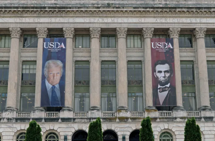 Banners with the photographs of President Donald Trump and former President Abraham Lincoln hang near the entrance 
of the U.S. Department of Agriculture building in Washington, May 16, 2025. (Jose Luis Magana/AP)