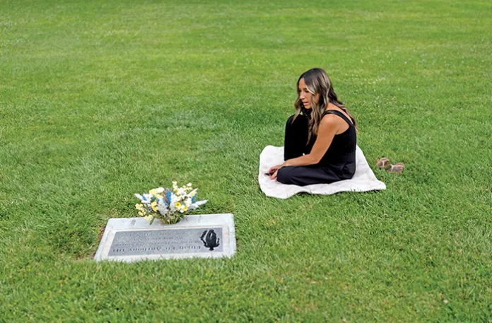 Mikayla Brown at the grave of her son, Elijah, who died of a fentanyl overdose at age 15, in Paso Robles, California, Aug. 2, 2024. (Jae C. Hong / AP)