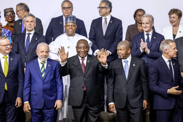 3 of 7 | From left, front row, Australia’s Prime Minister Anthony Albanese, Brazil’s President Luiz Inacio Lula da Silva, South Africa’s President Cyril Ramaphosa, President of Angola and Chairperson of the African Union Joao Lourenco and Canada’s Prime Minister Mark Carney react as they pose a group photo, on the opening day of the G20 Leaders’ Summit, in Johannesburg, South Africa, Saturday, Nov. 22, 2025. (Gianluigi Guercia/Pool Photo via AP)