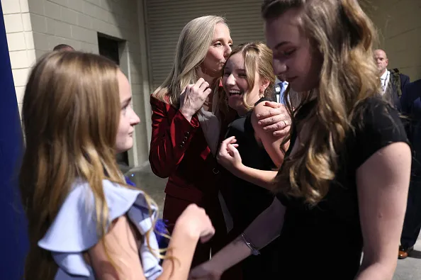 RICHMOND, VIRGINIA - NOVEMBER 04: Virginia Democratic gubernatorial candidate, former Rep. Abigail Spanberger embraces her daughter Charlotte, alongside her other daughters Claire and Catherine, as she arrives for her election night rally at the Greater Richmond Convention Center on November 04, 2025 in Richmond, Virginia. Spanberger defeated Republican gubernatorial candidate Lieutenant Gov. Winsome Earle-Sears to become the first female governor in the commonwealth’s history in an election that was seen as a national political bellwether leading into the midterms. (Photo by Win McNamee/Getty Images)