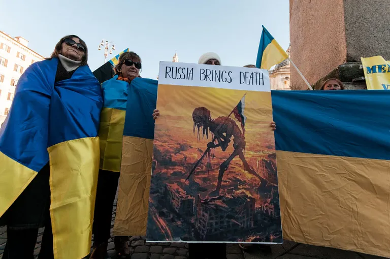 Members of the Ukrainian community in Rome, Italy, on November 23, 2025, gather to commemorate the Holodomor, the great famine of the 1930s orchestrated by Stalin, which decimates the Ukrainian population, and to march in solidarity with the Ukrainian people in response to the peace plan proposed by US President Trump. (Photo by Andrea Ronchini/NurPhoto via Getty Images)
