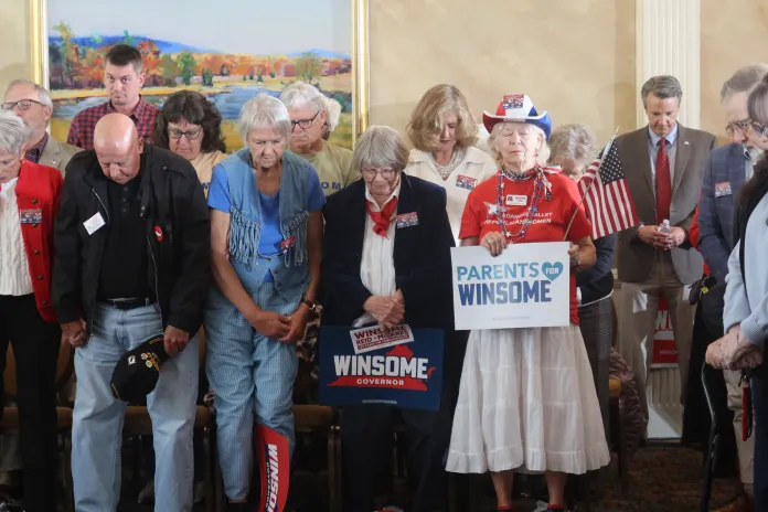 Supporters bow their heads in prayer before the start of a campaign rally for Lt. Gov. Winsome Earle-Sears in Roanoke, Virginia, on Monday. (Samantha-Jo Roth, Washington Examiner).