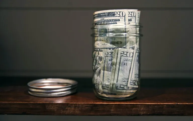 A canning jar filled with money.