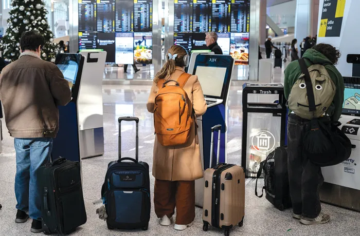 Travelers at Newark Liberty International Airport in New Jersey, on Nov. 24, 2025. (Victor J. Blue/Bloomberg via Getty Images)