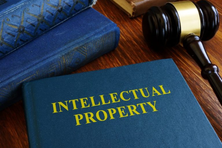 Intellectual property law about copyright on desk.
