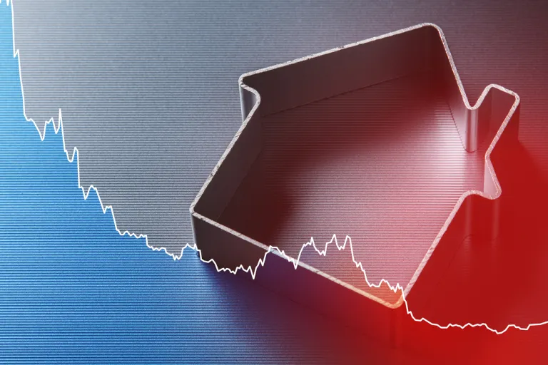 Real Estate Market Decline Concept with Falling Chart and House.