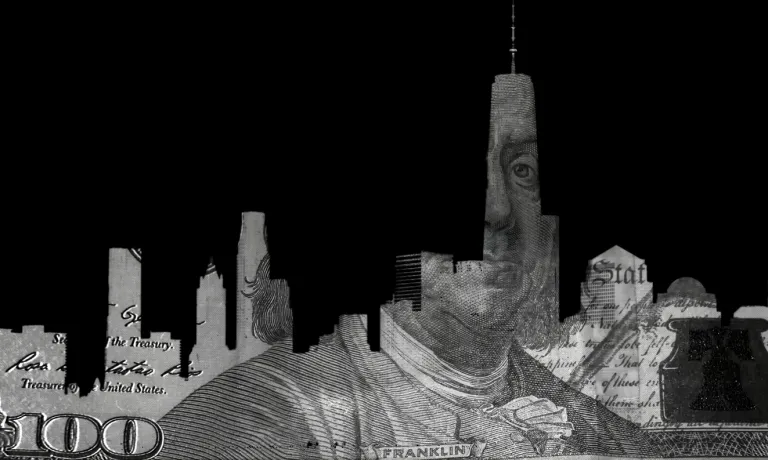 Hundred dollar bill in shape of NYC skyline on black background