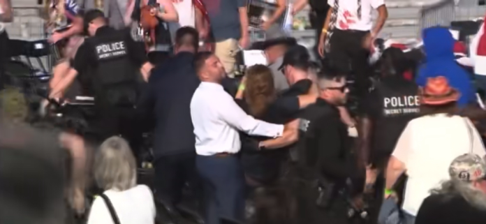 JD Longo helping carry someone at the rally in Butler County, PA., during the assassination attempt on President Donald Trump.