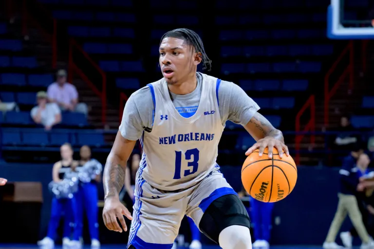 New Orleans guard Jamond Vincent (13) dribbles during an NCAA college basketball game.