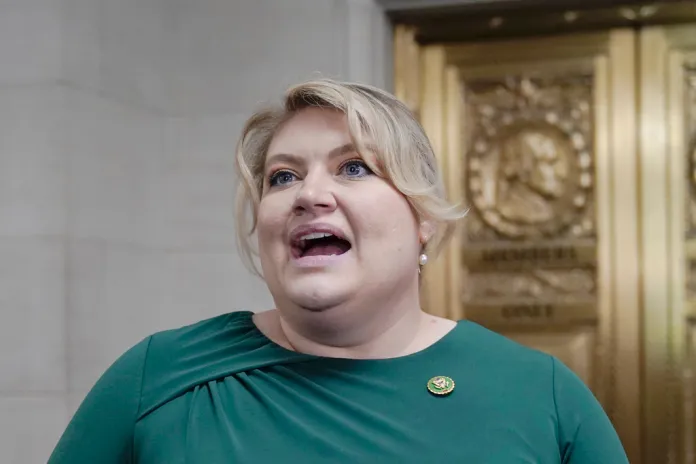 Kat Cammack speaks to reporters.