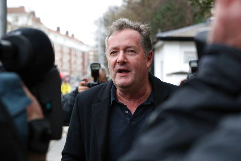 British television host Piers Morgan speaks to reporters outside his home in Kensington, central London.