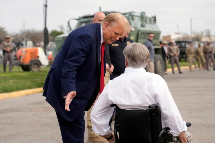 President Donald Trump talks with Texas Gov. Greg Abbott.