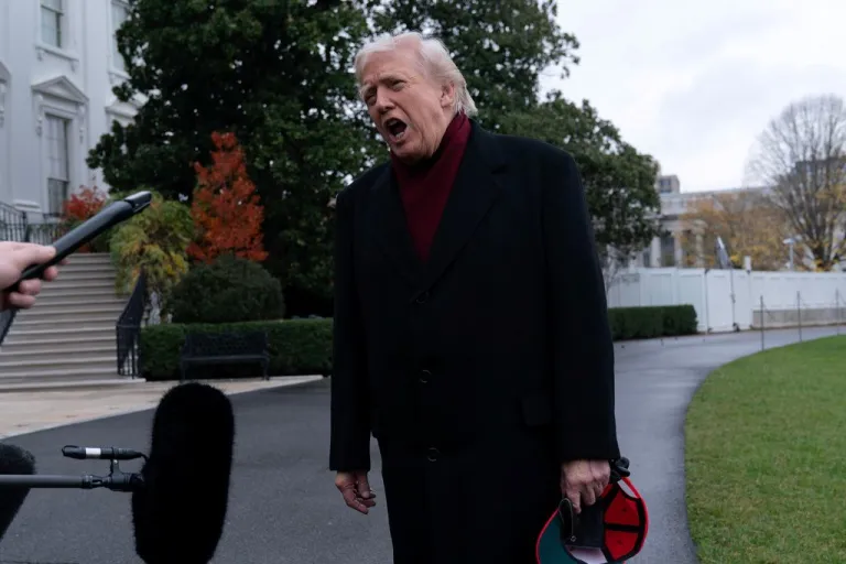 Trump speaks to reporters outside the White House.