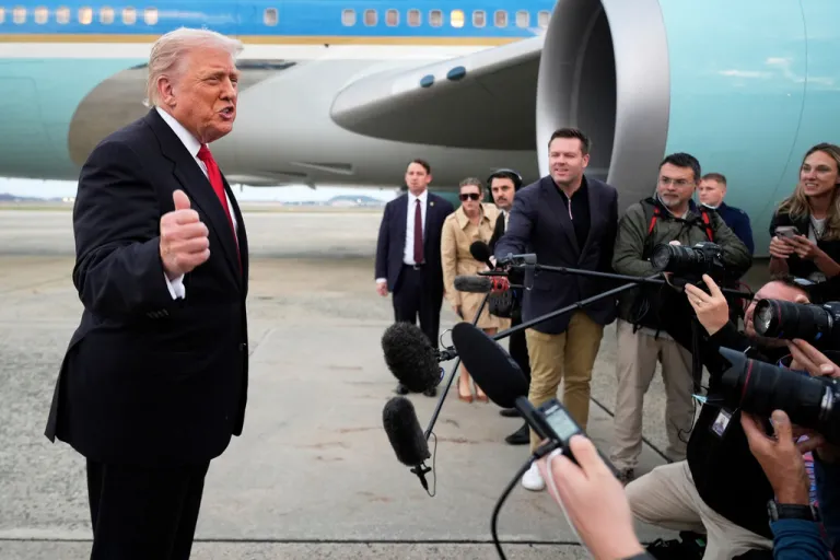 President Donald Trump speaks with reporters upon arriving on Air Force One at Joint Base Andrews, Md., Sunday, Nov. 9, 2025, on his way to attend a football game between the Washington Commanders and the Detroit Lions in Maryland. (AP Photo/Manuel Balce Ceneta)