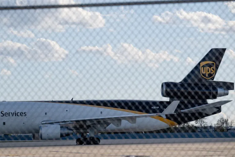 A UPS cargo plane is seen on the tarmac.