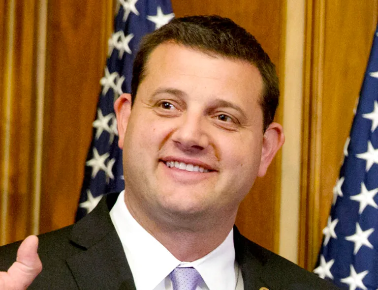 FILE - In this Jan. 6, 2015, file photo, U.S. Rep. David Valadao, R-Calif., poses during a ceremonial re-enactment of his swearing-in ceremony. (AP Photo/Jacquelyn Martin, File)