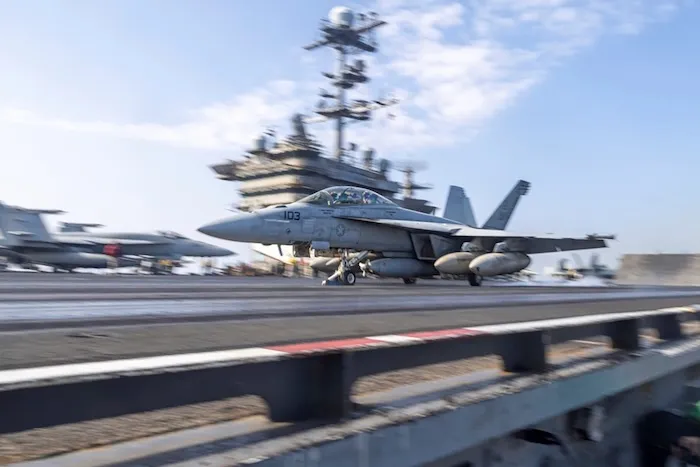 US aircraft landing on an aircraft carrier