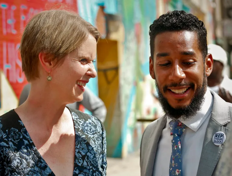 New York candidate for governor Cynthia Nixon, left, and New York City Councilman Antonio Reynoso leave a news conference.