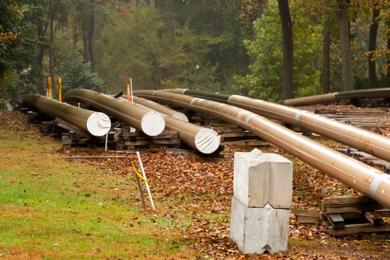 Pipes lay along a construction site.