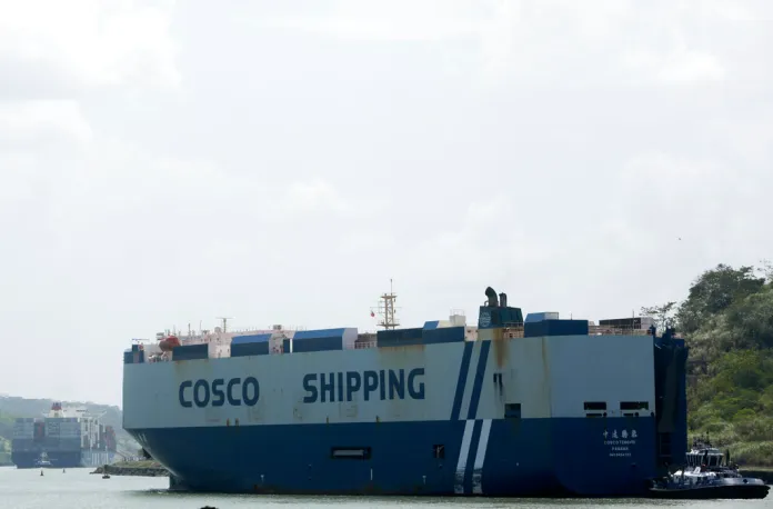A ship from the Hong Kong shipping firm Cosco sits in the Panama Canal