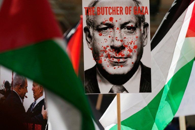Protester carries image of Benjamin Netanyahu covered in blood at 2023 rally in Sydney