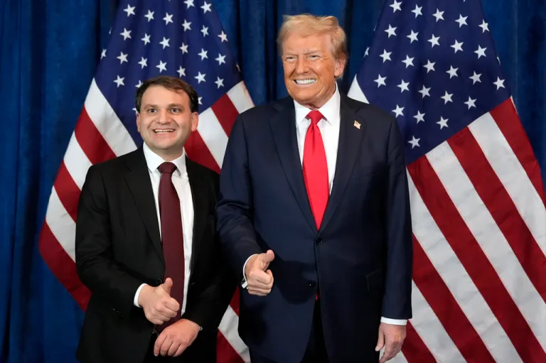 Republican presidential nominee Donald Trump poses for a photo with Wyoming Secretary of State candidate Chuck Gray before he speaks at a campaign rally.