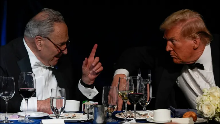 Then-Republican presidential nominee former President Donald Trump talks with then-Senate Majority Leader Chuck Schumer (D-NY).
