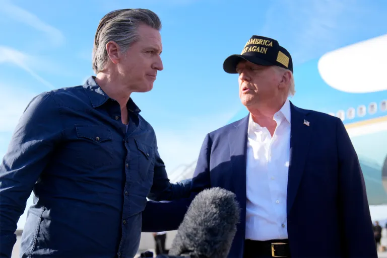 President Donald Trump talks with California Gov. Gavin Newsom