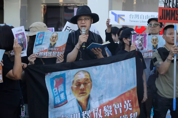Activists in Taiwan protest the conviction of Jimmy Lai.
