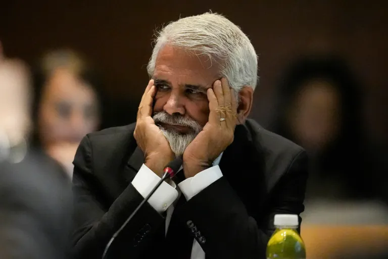 FILE - Dr. Robert Malone listens during a meeting of the Advisory Committee on Immunization Practices at the CDC, June 25, 2025, in Atlanta. (AP Photo/Mike Stewart, File)