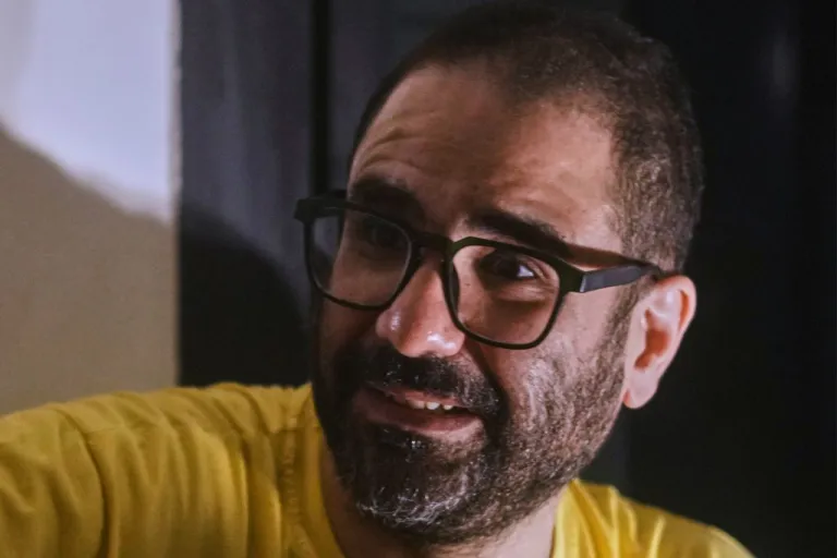 Pro-democracy Egyptian-British activist Alaa Abd el Fattah, who was in prison for almost all of the past 12 years, speaks to his family as he arrives at his home, after a presidential pardon, in Cairo, Egypt.