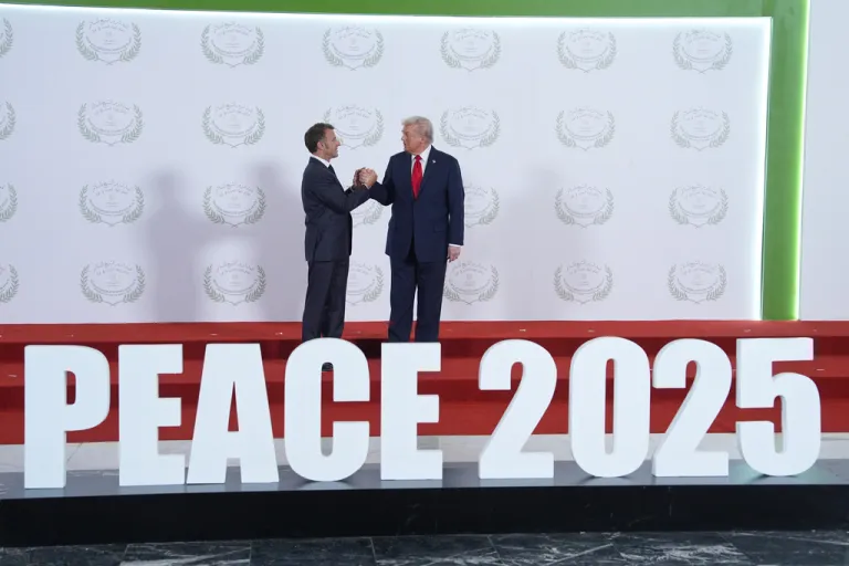 President Donald Trump greets France's President Emmanuel Macron during a summit Monday, Oct. 13, 2025, in Sharm El Sheikh, Egypt.