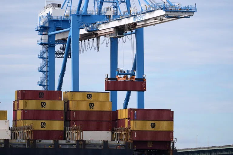 A ship is loaded with a container at the Port of Philadelphia.