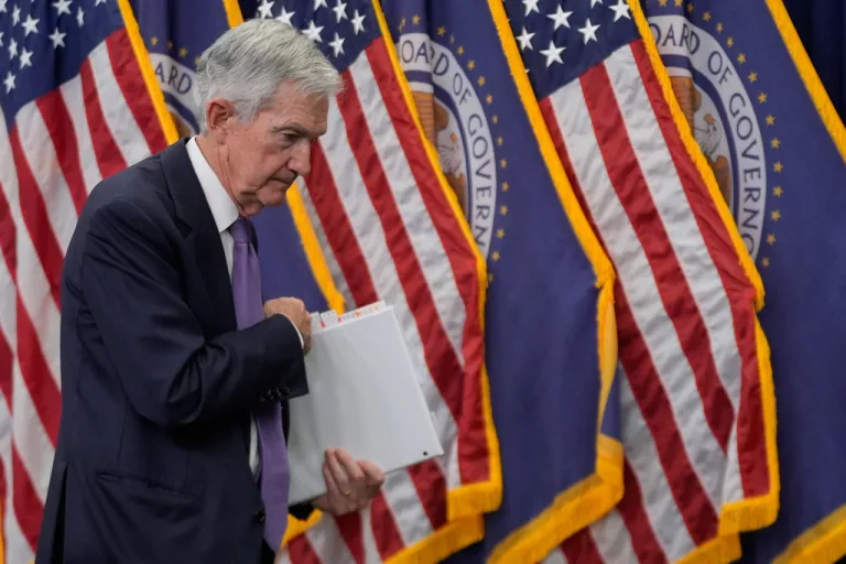 Federal Reserve Chairman Jerome Powell departs after a news conference.