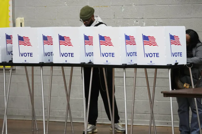 Voters fill out their ballot Tuesday, Nov. 4, 2025, in Detroit. (AP Photo/Paul Sancya)