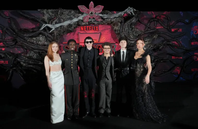 Sadie Sink, Caleb McLaughlin, Finn Wolfhard, Gaten Matarazzo, Noah Schnapp, and Millie Bobby Brown pose together at the world premiere of the fifth season of 