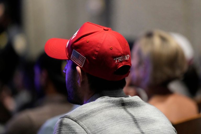 An attendee listens to speakers during the 