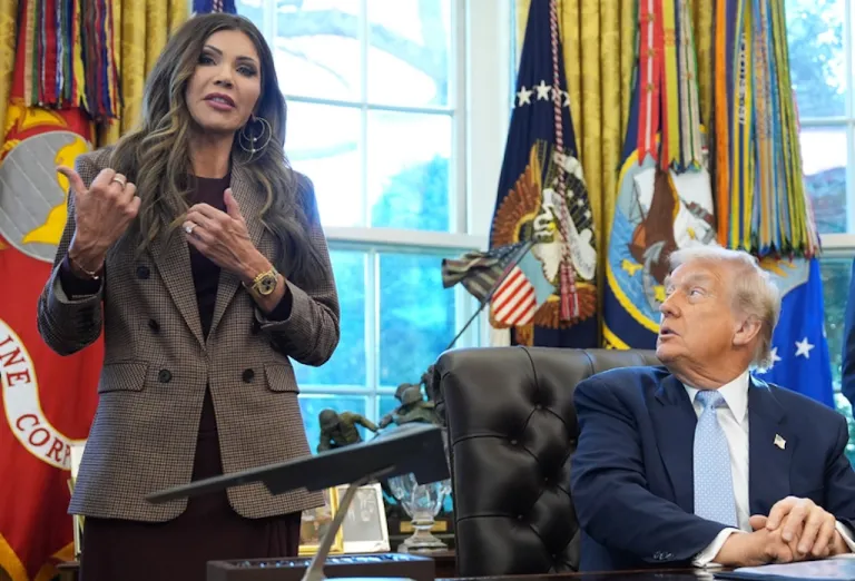 President Donald Trump and FIFA President Gianni Infantino listen as Homeland Security Secretary Kristi Noem speaks during a meeting with the White House task force on the 2026 FIFA World Cup.