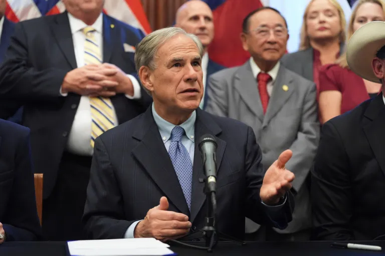 Texas Gov. Greg Abbott speaks to the media following a bill signing as Texas senators debate a bill on a redrawn U.S. congressional map during a special session in the Senate Chamber at the Texas Capitol in Austin, Texas, Aug. 22, 2025.