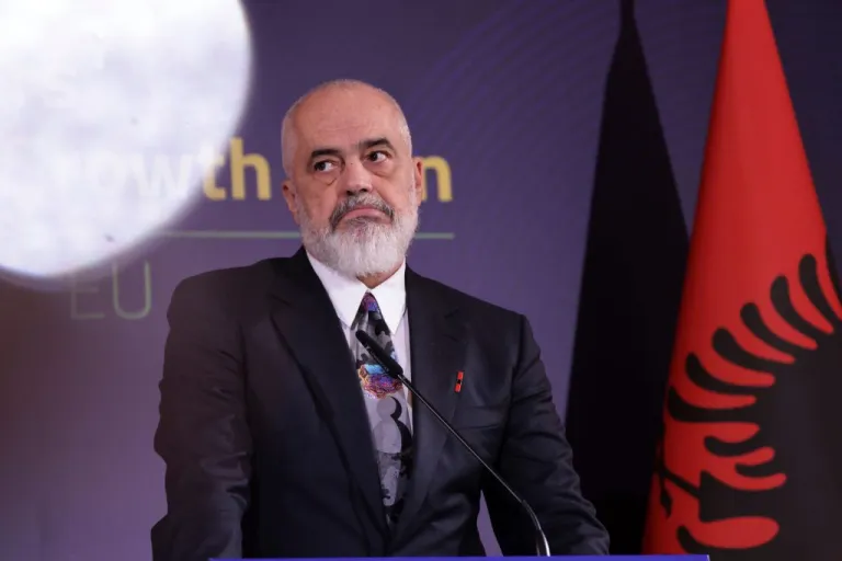 Albania's Prime Minister Edi Rama joins a press conference.